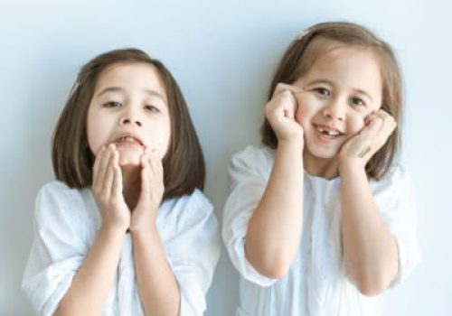 Happy children smiling after pediatric dental treatment